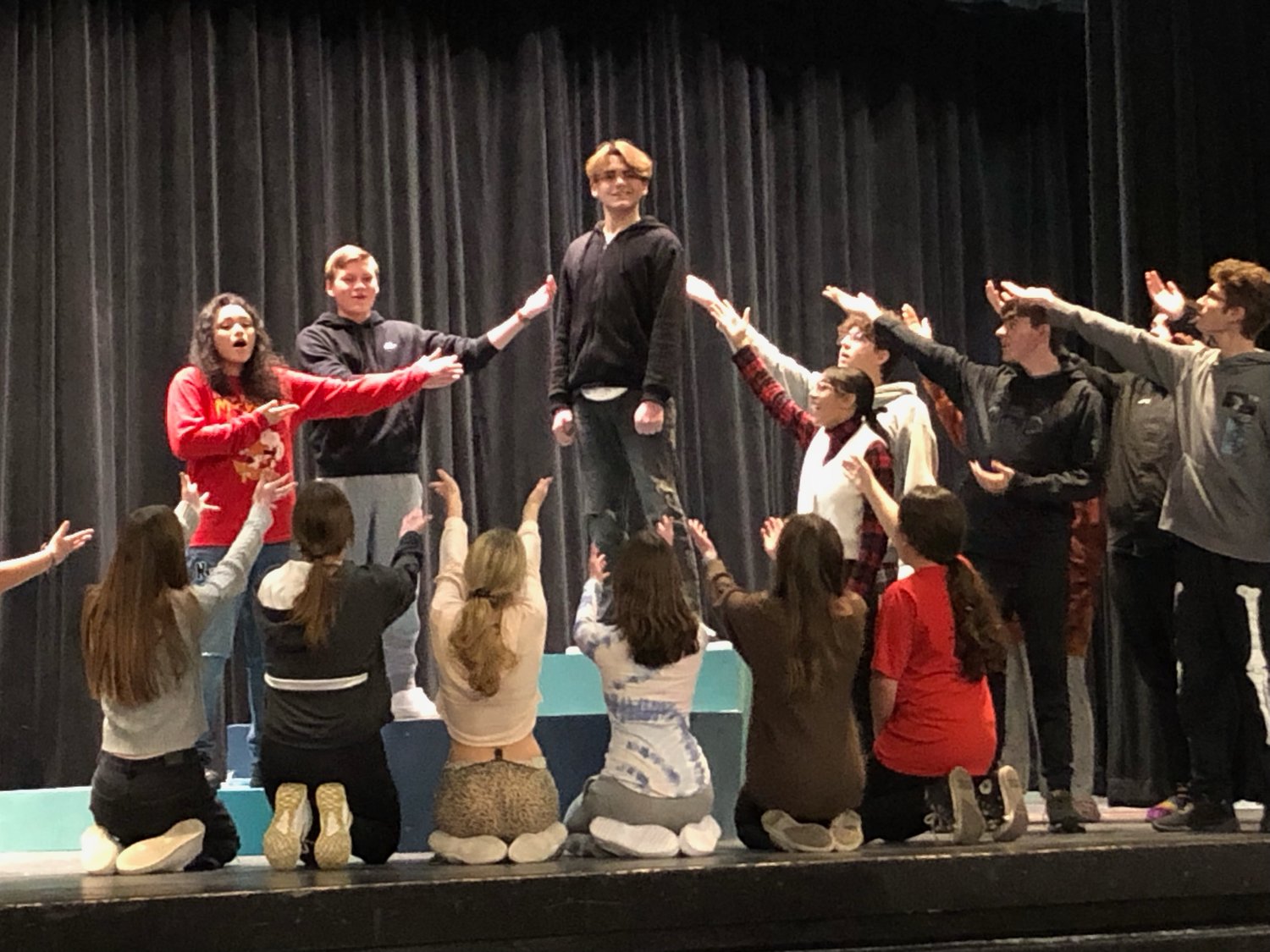 GETTING READY TO PERFORM: Cranston West students prepare for “Bye Bye Birdie” by singing “Healthy, Normal, American Boy.” (Submitted photo)